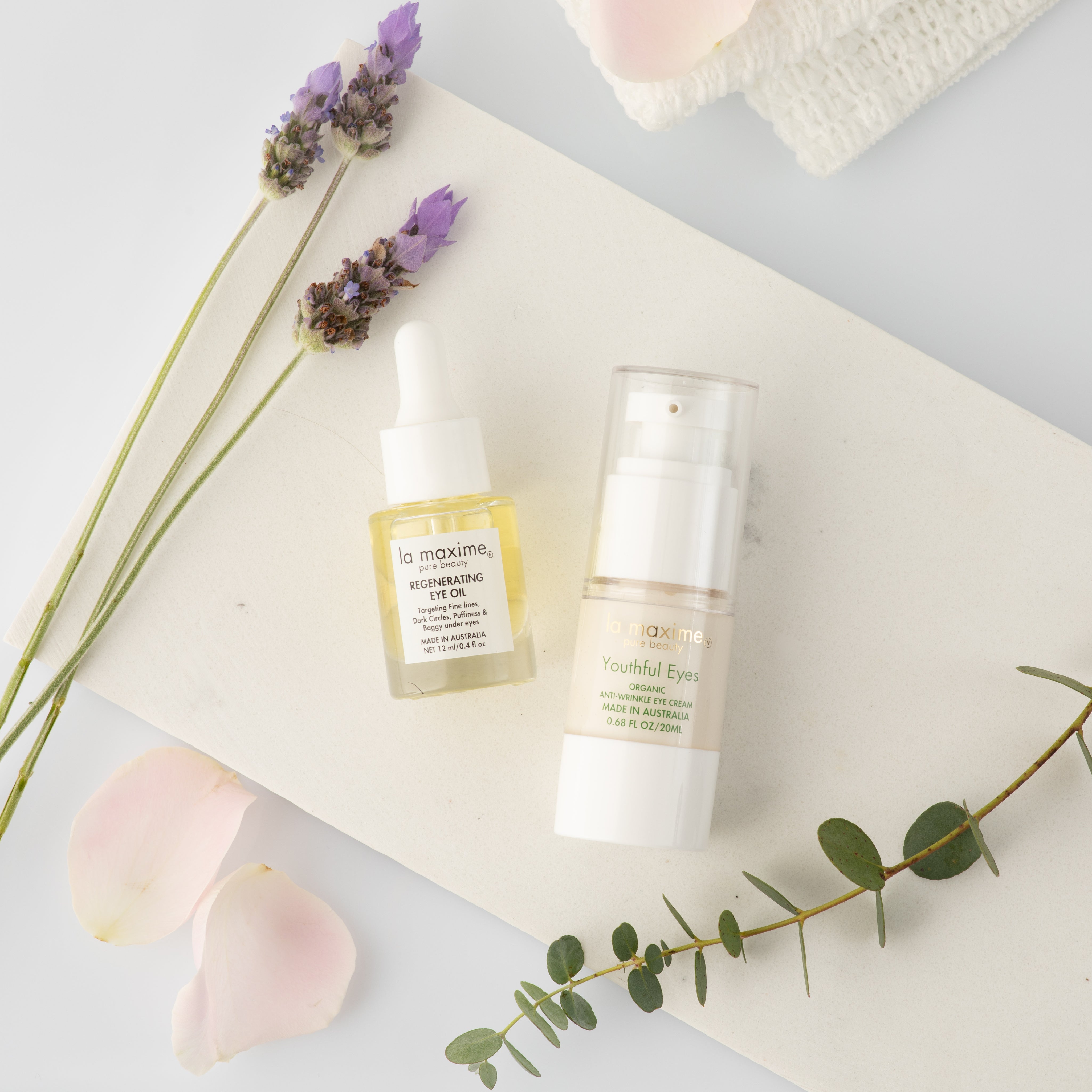 Eye oil and eye cream flat lay with botanical elements for mature skin hydration and smoothing