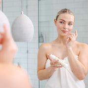 Applying antioxidant night cream as part of evening skincare routine for hydration and skin repair
