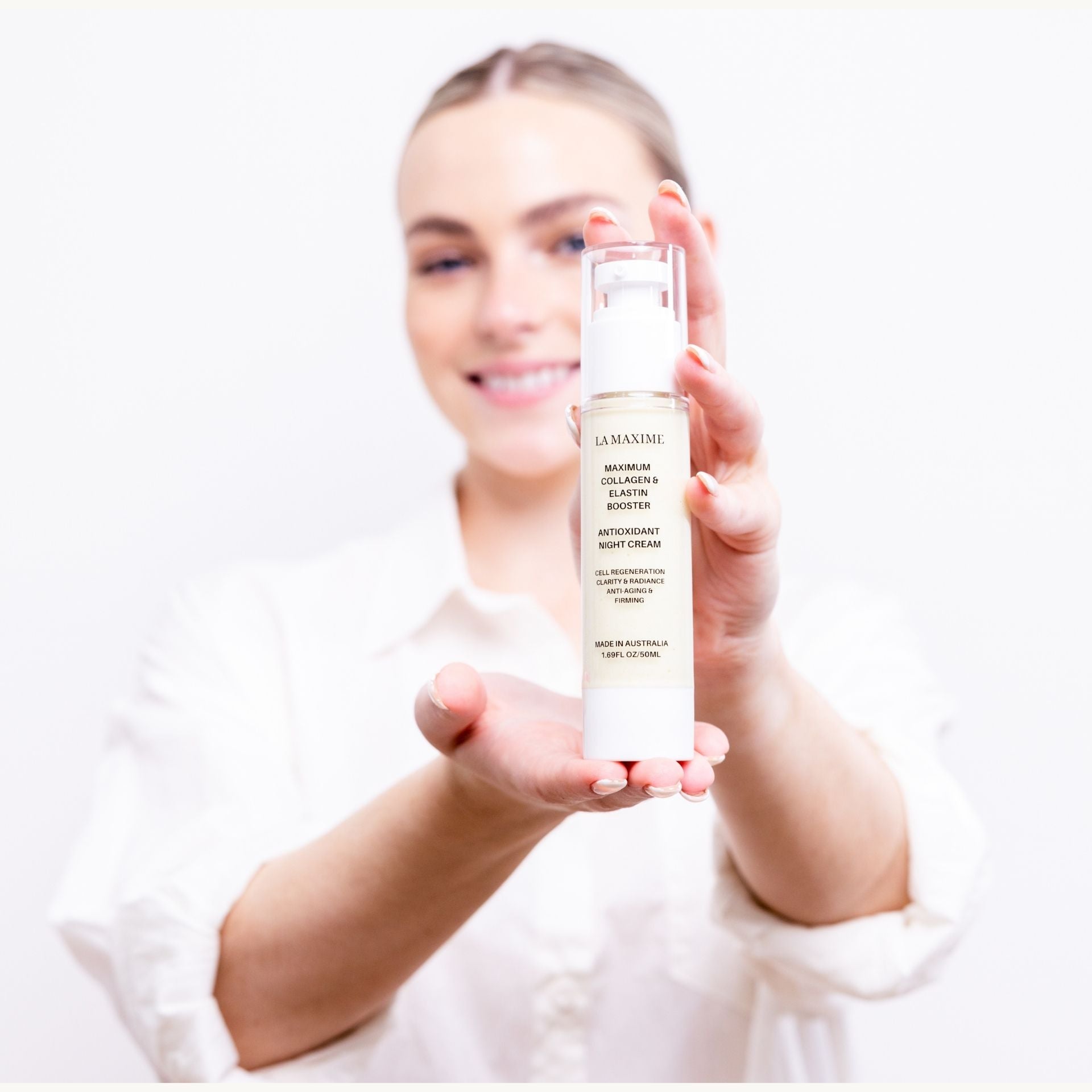 Woman holding LA MAXIME night cream showing visible results for smoother firmer skin