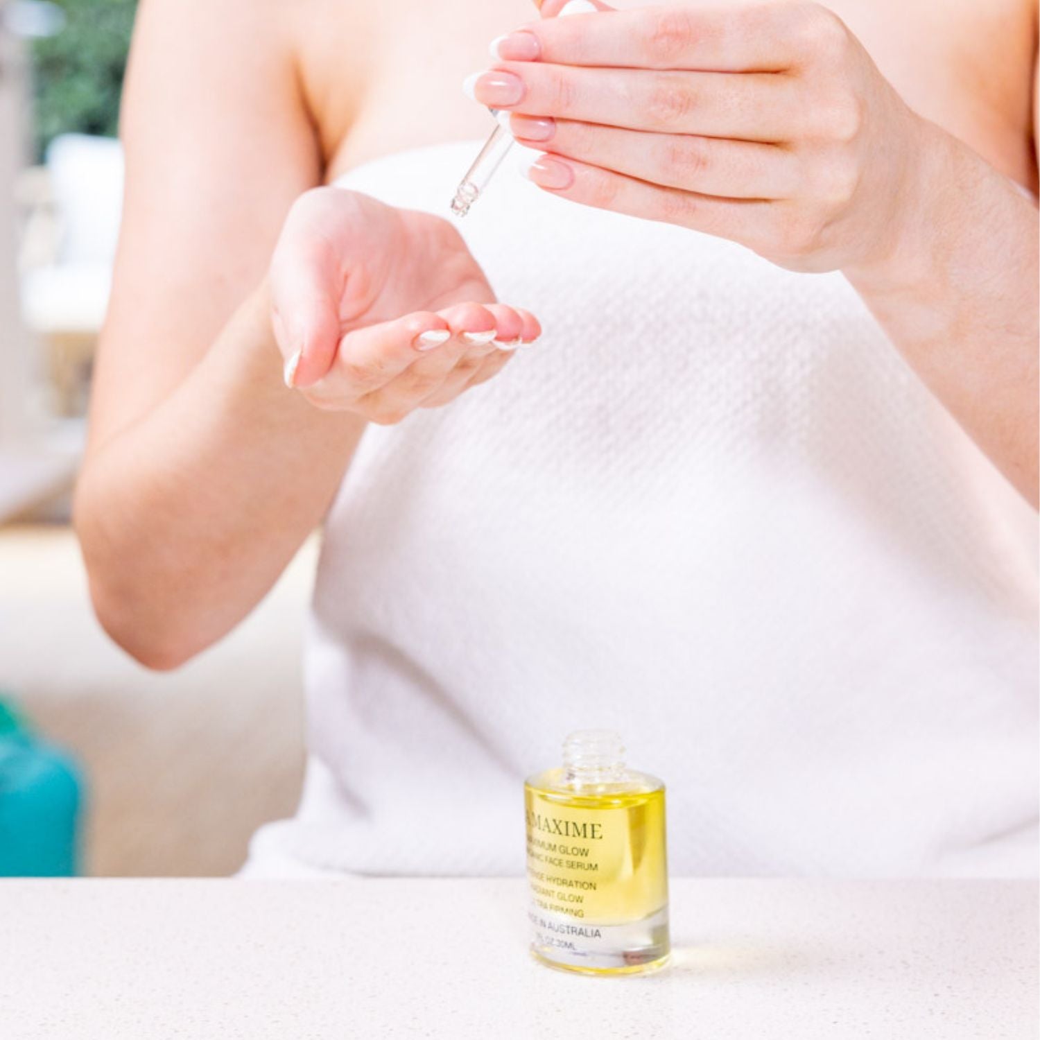 Applying Radiant Glow face oil serum for hydration and improved skin radiance in daily skincare routine