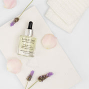 natural hair oil with botanical ingredients for hydration repair and shine